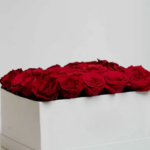 25 freshly sourced red roses in a stylist ivory box.