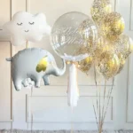 Create a memorable balloon arrangement for your special occasion! 1 helium cloud 1 helium elephant 1 personalized bubble balloon 9 confetti helium latex balloons color theme and wording can be customized