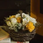Gift a loved one this adorable small floral arrangement with white roses in a handmade kithul basket.