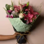 Gift a loved one this beautiful arrangement which includes rose, lily, chrysanthemum, wild flowers and foliage.