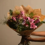 Gift a loved one this gorgeous arrangement which includes; lilies, celosia, wild flowers, eucalyptus, foliage and chrysanthemum