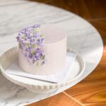 Please note the flavor profile of your choice at checkout: ribbon cake , ribbon almond the cake has dimensions of 6 inches in diameter and 4-5 inches in height