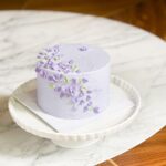 Please note the flavor profile of your choice at checkout: ribbon cake , ribbon almond the cake has dimensions of 6 inches in diameter and 4-5 inches in height