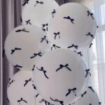 Create a memorable balloon arrangement for your special occasion! 7 latex balloons with bows color theme can be customized