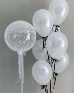 Create a memorable balloon arrangement for your special occasion! 1 bubble balloon with 7 latex balloons Color theme can be customized
