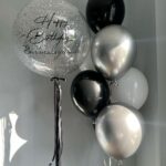 Create a memorable balloon arrangement for your special occasion! 1 personalized bubble balloon and 7 latex balloons color theme can be customized