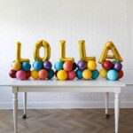 This arrangement includes six foil letter balloons (not helium) and latex balloons. The balloon color theme and letters can be customized to your preference. Foil letters are available in gold, silver, and rose gold, and they are 16” in size.