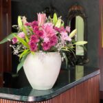 Surprise your loved one with an exquisite flower arrangement featuring delicate pink lilies and soft shades of pink chrysanthemums, all beautifully displayed in a stylish beige pot. A graceful gift that exudes elegance and warmth