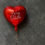 Red heart shaped helium balloons