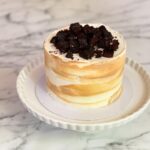 Indulge in a decadent 1. 3kg vanilla salted caramel cake, featuring rich layers of caramel and fudgy bits for the perfect balance of sweetness and indulgence the cake has dimensions of 6 inches in diameter and 4-5 inches in height