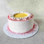 Lemon basil berry delight – fragrant basil seed sponge cake filled with zesty lemon curd and basil-strawberry compote, wrapped in light whipped cream. A fresh and vibrant treat! Measuring 7 inches in diameter and 3-4 inches in height.