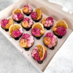 12 delicious cupcakes in pink color with dried lemon