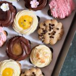 An assortment of 12 luxe cupcakes